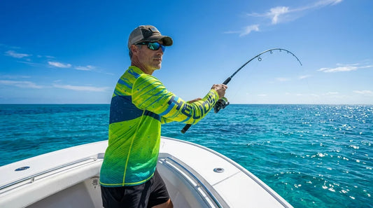 angler in long-sleeve UPF shirt casting from open boat deck in bright midday sun, clear blue water, sunlight reflecting off surface