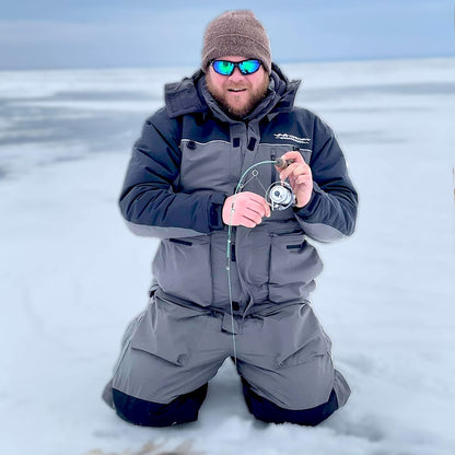 Detail view of grey and navy blue ice gear jacket showing insulation and pocket features