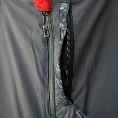 Detail view of charcoal grey ice gear jacket showing insulation and pocket features
