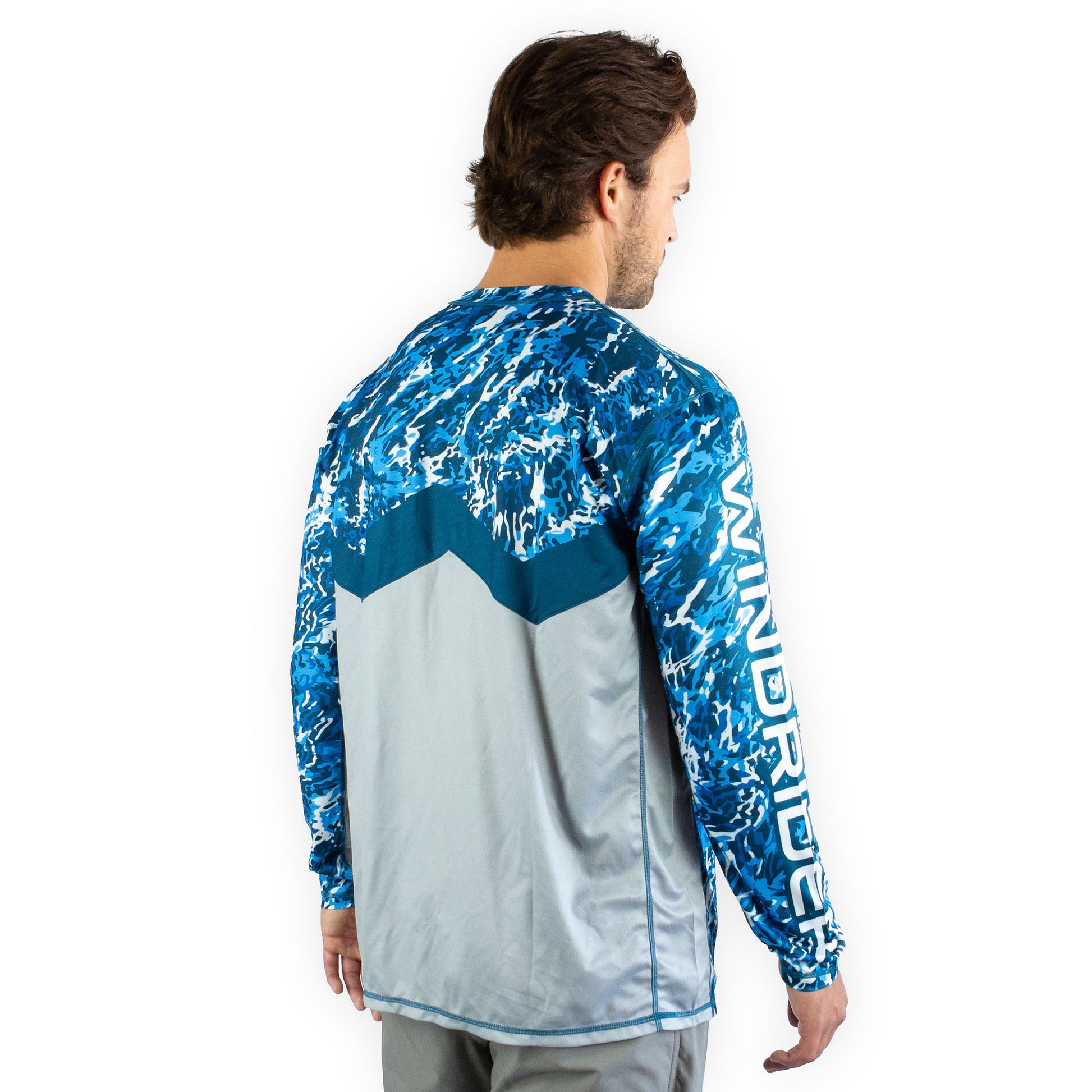 Man in blue camo sol invictus pro shirt three quarter view showing mesh side ventilation