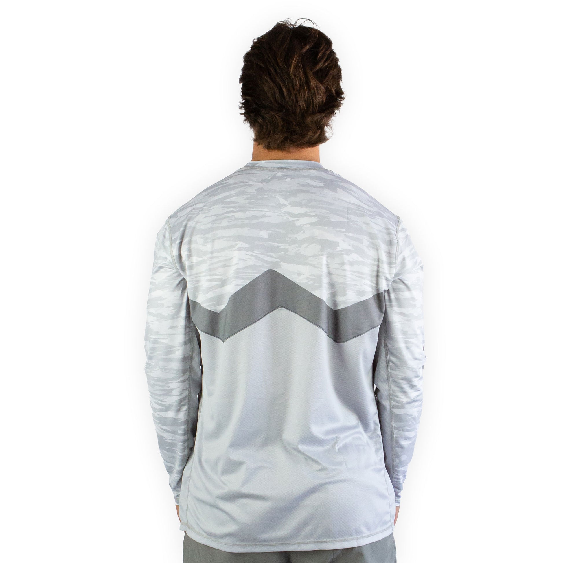Man in white snowy tundra sol invictus pro shirt three quarter studio view showing fit
