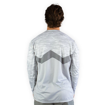 Man in white snowy tundra sol invictus pro shirt three quarter studio view showing fit
