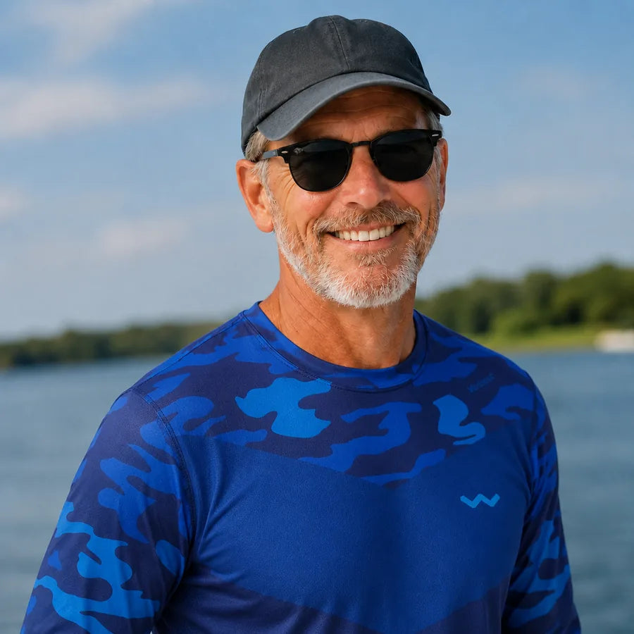Customer enjoying a sunny day on the water in a Helios sun shirt.